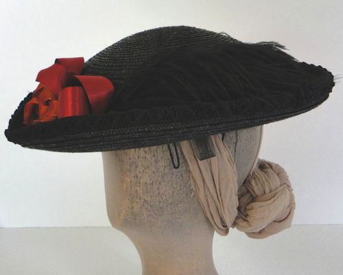 The hat is held on with wires and horsehair tabs that can be pinned through.